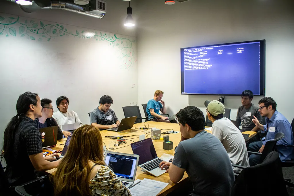 Uber Fellows watching a demonstration by Uber Fellowship Instructor, Francis Li, inside Uber HQ